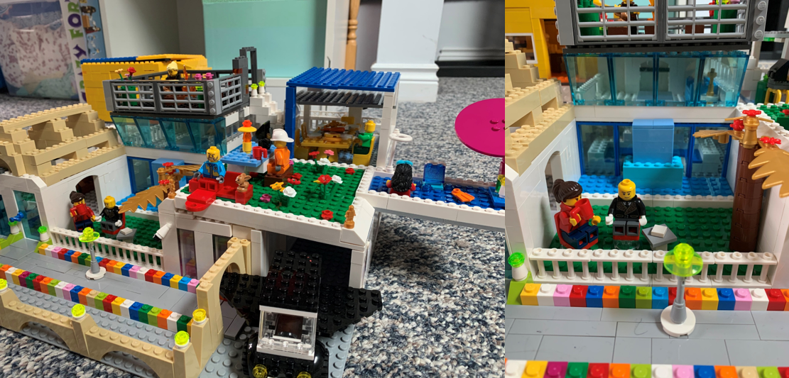 1)	A family’s LEGO® creation, called "A Canadian Future Family House," sits on the floor.