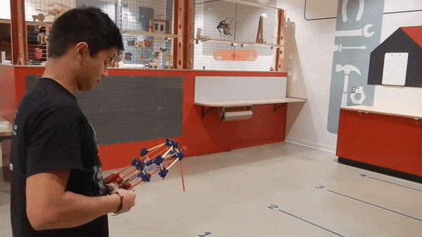 A K’NEX crossbow is wound up and then released, firing an arrow made out of K’NEX at high speed.   