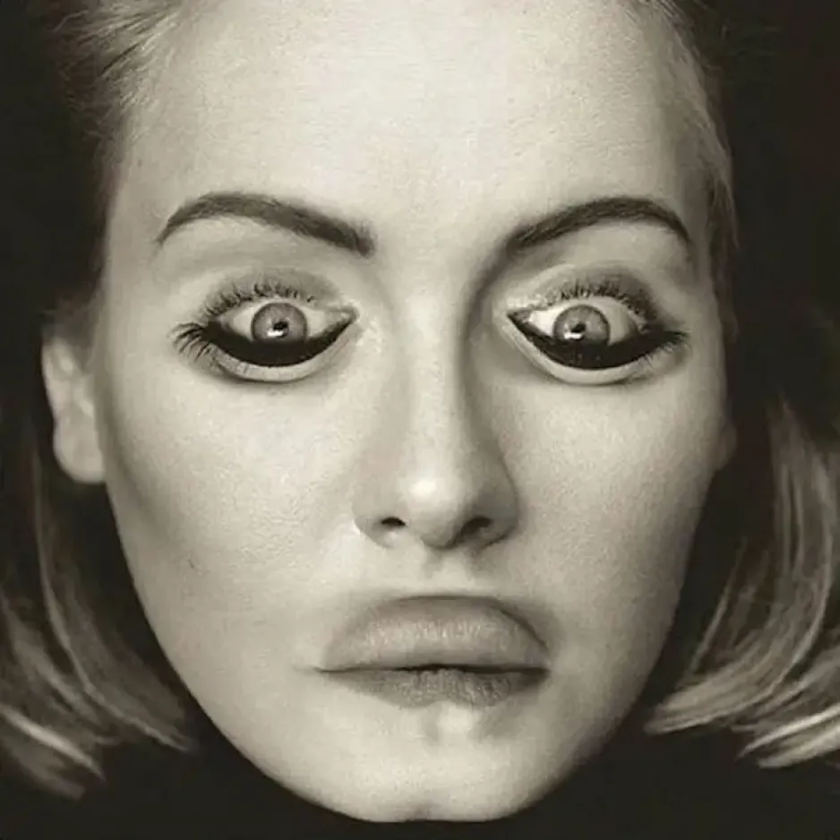 A black-and-white image shows a close-up of a woman’s face. The eyes and the mouth are upside down on the face, giving it a garish appearance.