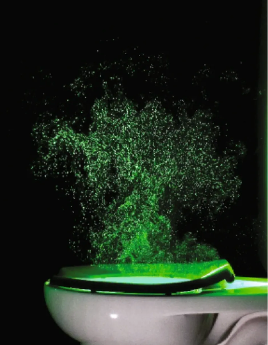 A side view of a toilet bowl in front of a black background. Above the toilet seat is a neon green mushroom cloud of aerosolized toilet water reaching about a metre above the level of the seat.  