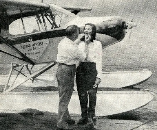 Nicolas Gouroff with a patient near the Piper PA-12 Super Cruiser piloted by his younger son, Pierre Gouroff. He could be playing dentist for the benefit of a photographer. Anon., “Dentistry by Air.” Flying, May 1948, 52.