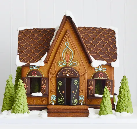 A little cottage-like house made of gingerbread.