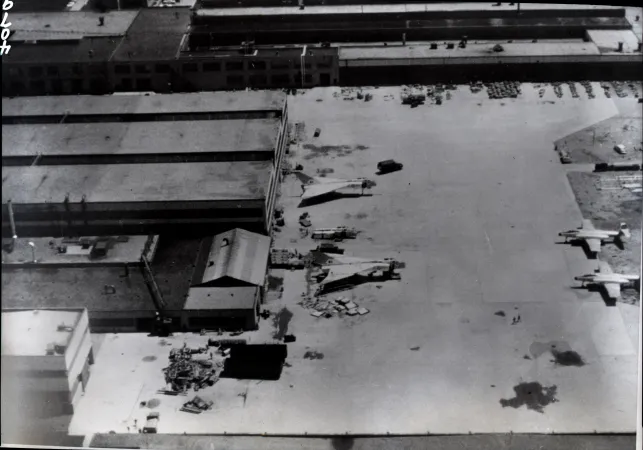 A black-and-white image showing the last two Arrows in the process of being destroyed.