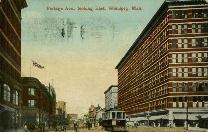Colour post card showing streetcar on Portage Avenue in Winnipeg