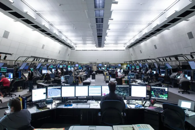 NAV CANADA employees work on computers at an area control centre in Winnipeg