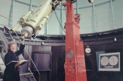 Mary Grey by the Dominion Observatory's historic refracting telescope.