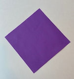 A piece of square purple paper positioned in a diamond shape.