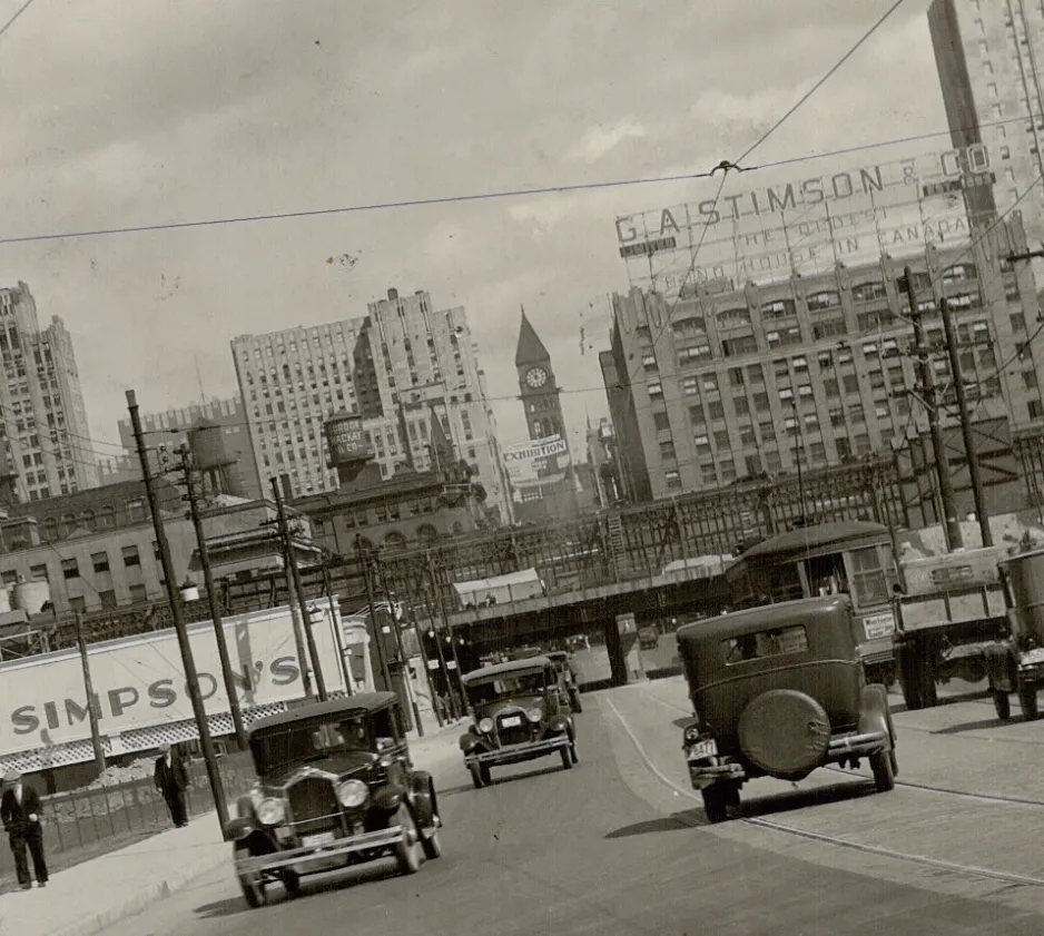 Skewed look at automobiles driving on Bay Street in Toronto in 1931.