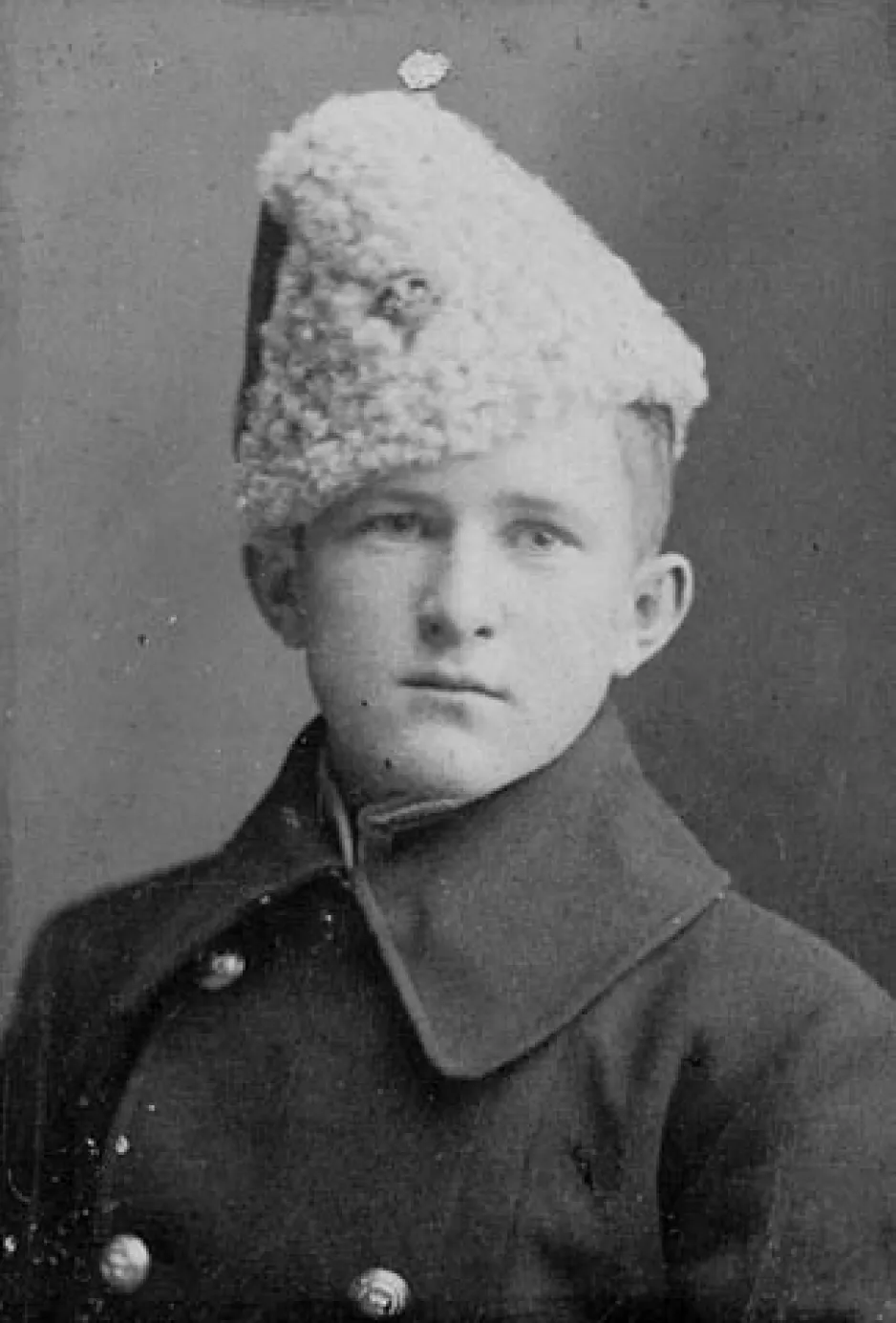 A black-and-white image of a young William Avery Bishop in his cadet uniform and hat.