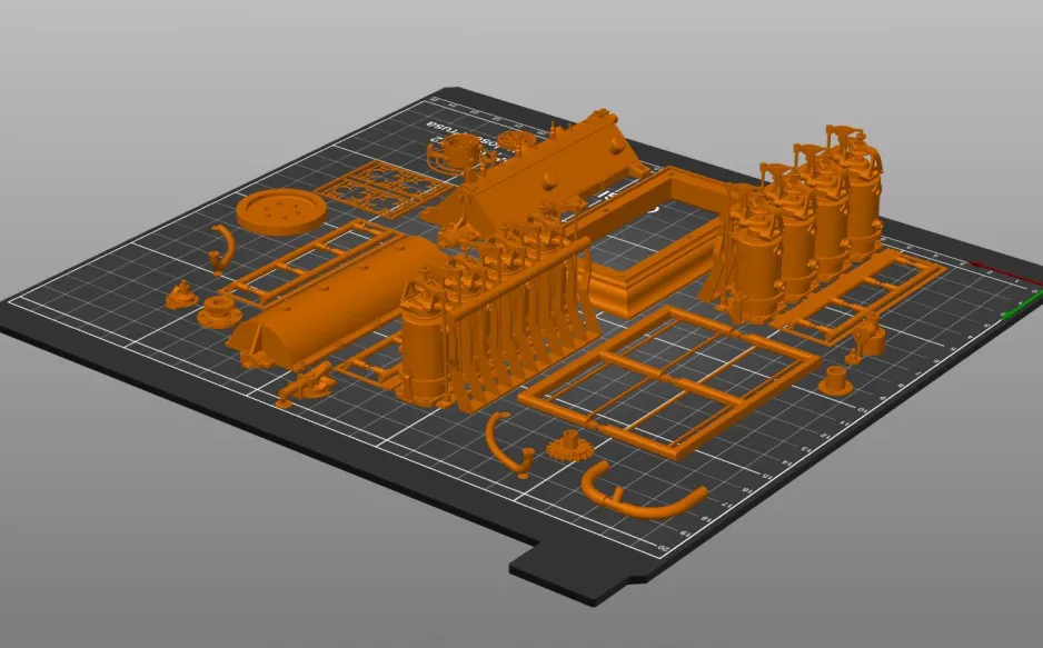 A photo of parts of the model arranged on the build plate of an FDM printer. 