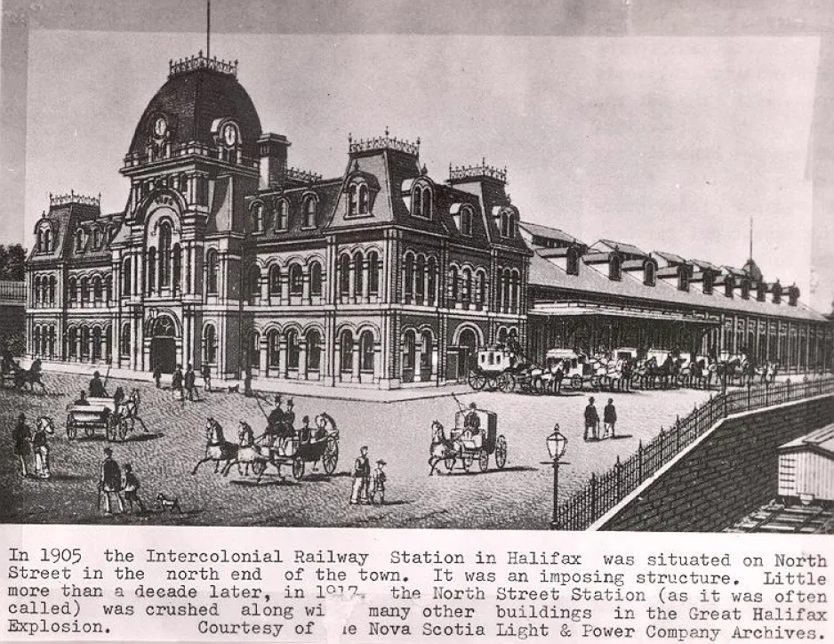 A black and white illustration of an ornate three story building with a clock tower. Behind the build is a covered train terminal. Horse-drawn carriages are lined up to take passengers from the station.