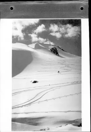 Black and white photograph showing a skiier on Signal Mountain, near Jasper, Alberta.
