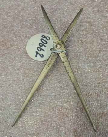 Antique tool with an artifact number tag