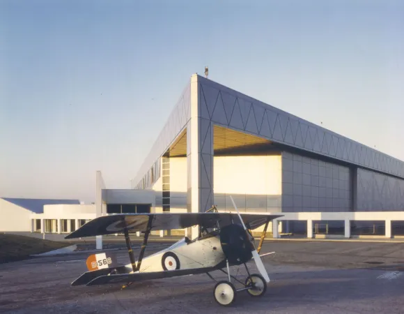 A biplane in front of the museum