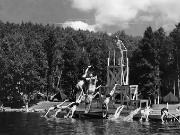 Children diving into the lake at Arowhon Camp
