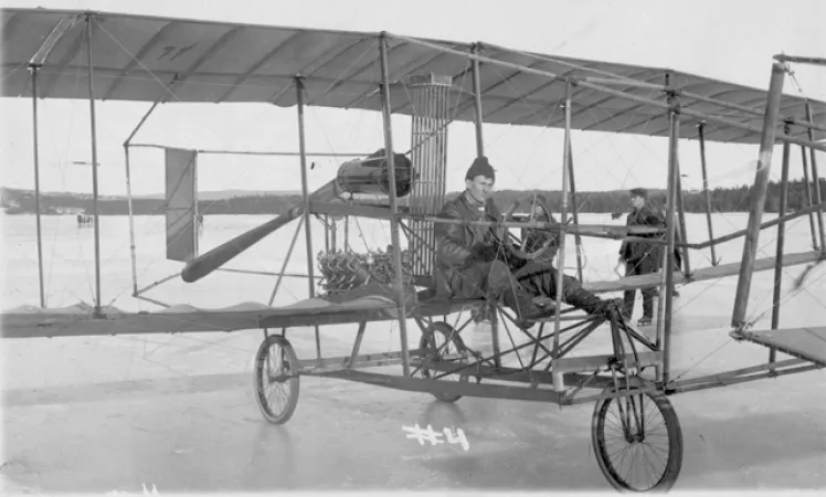 John McCurdy seated in the Siver Dart at the time he made the first powered and controlled flight in Canada, 1909. (CASM-15495)