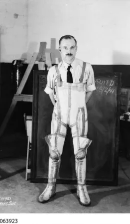 Wilbur Franks trying on his G-suit, 1941: Library and Archives Canada PA-063923