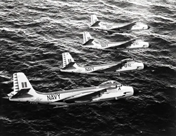 3 McDonnell F2H-3 Banshee flying over the ocean