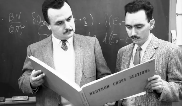 Bertram Brockhouse (left), a Professor at McMaster University, mentors a student in the application of neutron beams to study materials. Later, he would win the Nobel Prize in Physics in 1994.