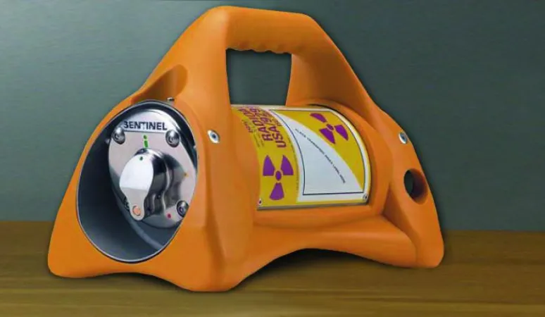 Exposure device used in industrial radiography. It contains radioactive sealed sources tracked under the SSTS.