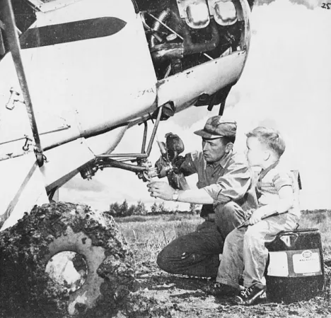 Eldon Douglas McEarchern working on his agricultural Piper PA-18 Super Cub as one of his sons watched on, Carman, Manitoba. Anon., “Les fermiers volants de l’ouest canadien.” Le Samedi, 22 October 1960, 25.