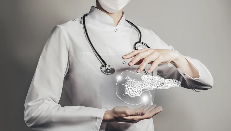 A pancreas made of light floats between the hands of a woman wearing a white lab coat, a mask, and a stethoscope. 