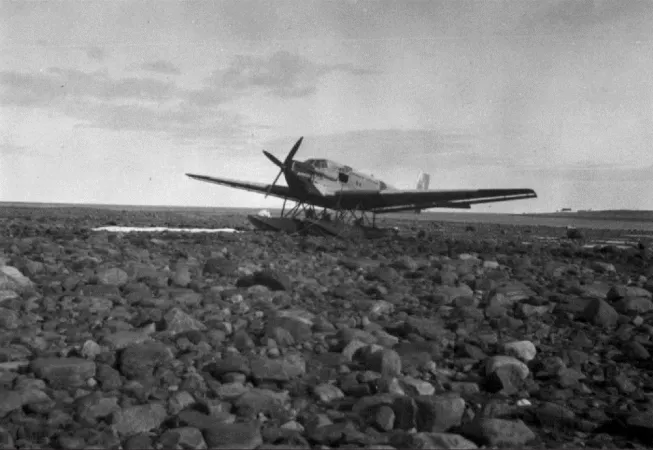 The Junkers Ju 52 bushplane registered as CF-ARM of Canadian Airways Limited of Montréal, Québec, under repair, Arviat, Nunavut (Eskimo Point, Northwest Territories), September 1932. CASM, 1208.