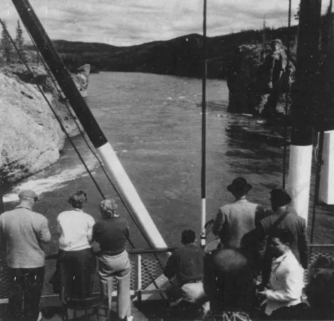 Passengers of the Canadian sternwheeler river boat SS Klondike watch as their ship was about to cross a narrow passage of the Yukon River, at the Five Finger Rapids, Yukon Territory. David Willock, “There’s Tourist Gold in the Yukon.” The Ottawa Citizen – Weekend Magazine, 25 June 1955, 18. 