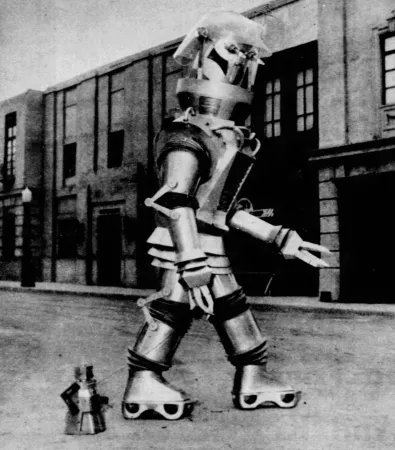 Une photographie montrant le robot Tobor emmenant un des innombrables robots jouets Robert le robot fabriqués en 1954 pour une promenade, New York, New York. Anon., « Cameroddities. » Today... The Philadelphia Inquirer Magazine, 24 octobre 1954, 32.