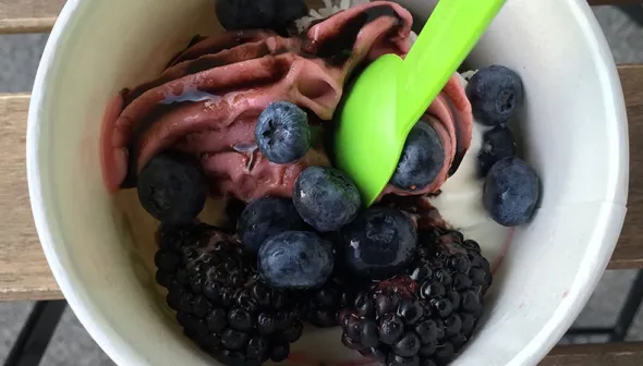 frozen yogurt with blueberries and raspberries on top