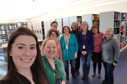 Ingenium staff take a group “shelfie” in the new Ingenium Centre Library and Archives.