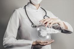 A pancreas made of light floats between the hands of a woman wearing a white lab coat, a mask, and a stethoscope. 