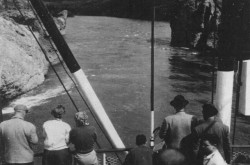Passengers of the Canadian sternwheeler river boat SS Klondike watch as their ship was about to cross a narrow passage of the Yukon River, at the Five Finger Rapids, Yukon Territory. David Willock, “There’s Tourist Gold in the Yukon.” The Ottawa Citizen – Weekend Magazine, 25 June 1955, 18. 